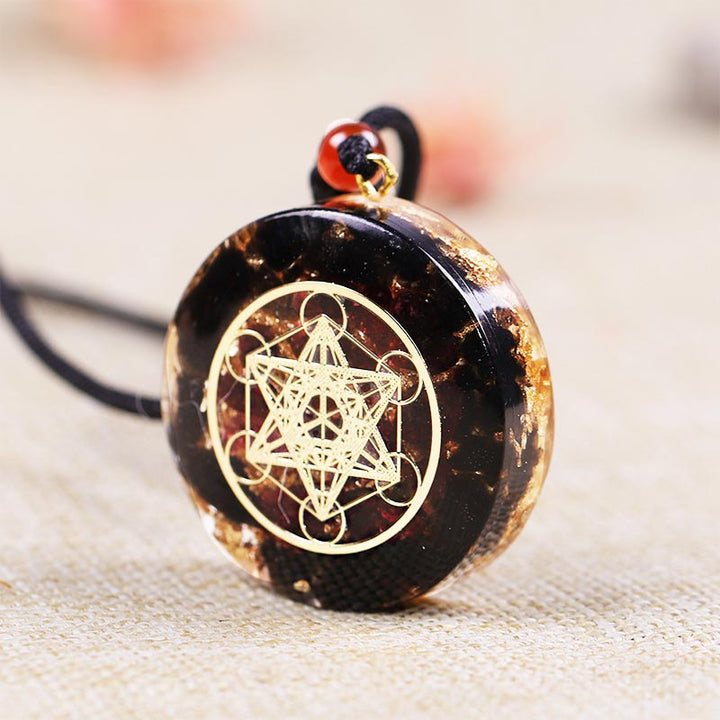 Collana con simbolo del cubo di Metatron in ossidiana e granato Olivenorma