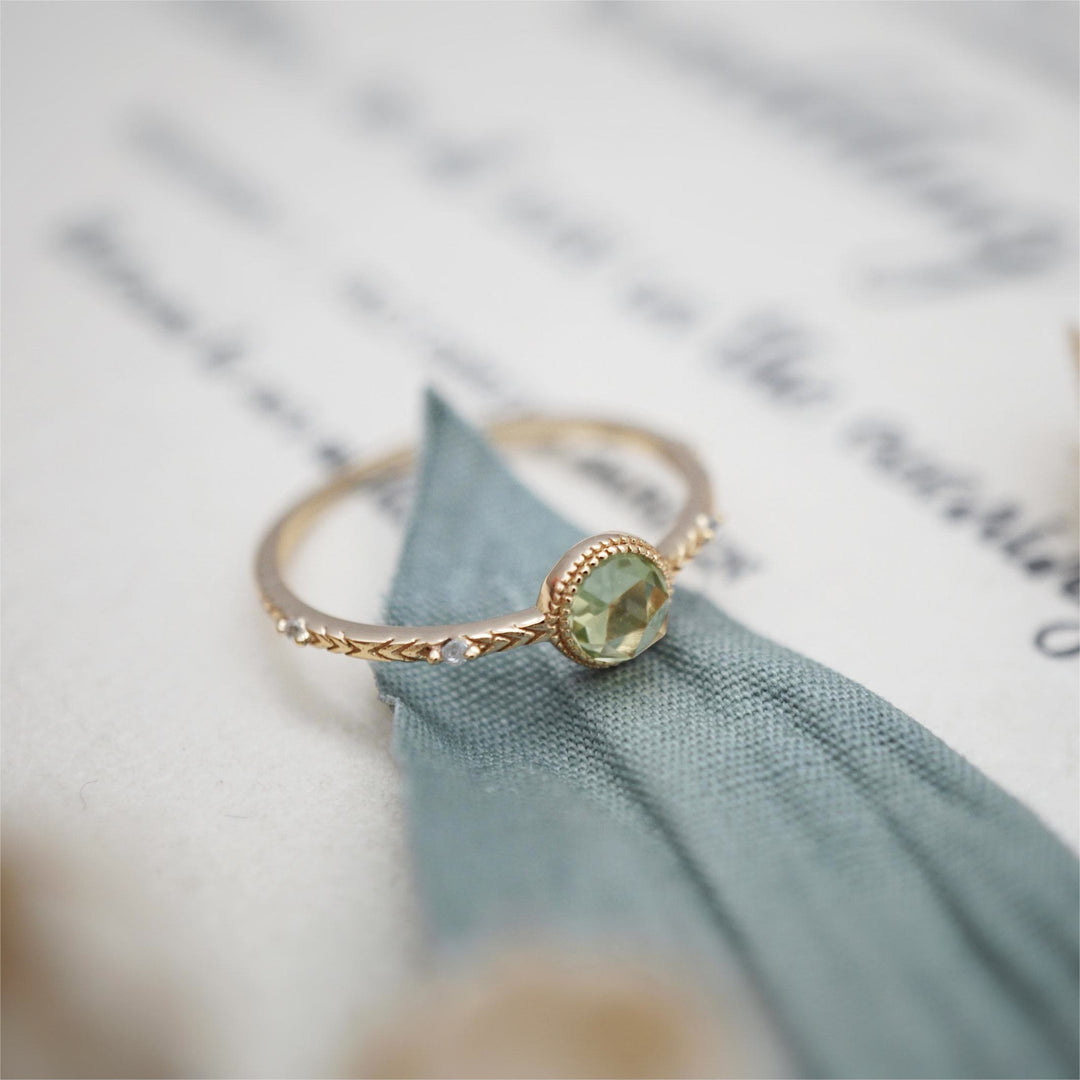 Anello Olivenorma con peridoto verde taglio rotondo naturale