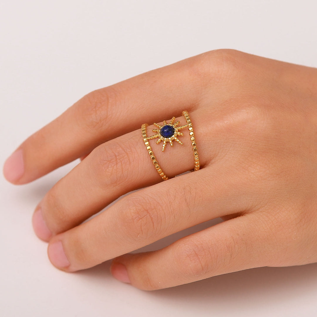 Anello con gemma a forma di stella a otto punte e doppia fila di girasole Olivenorma
