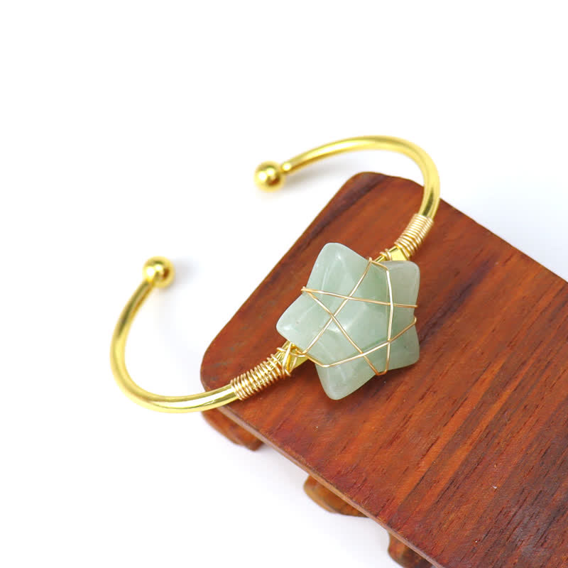 Bracciale Olivenorma con pietre preziose a forma di stella avvolte in filo d'oro