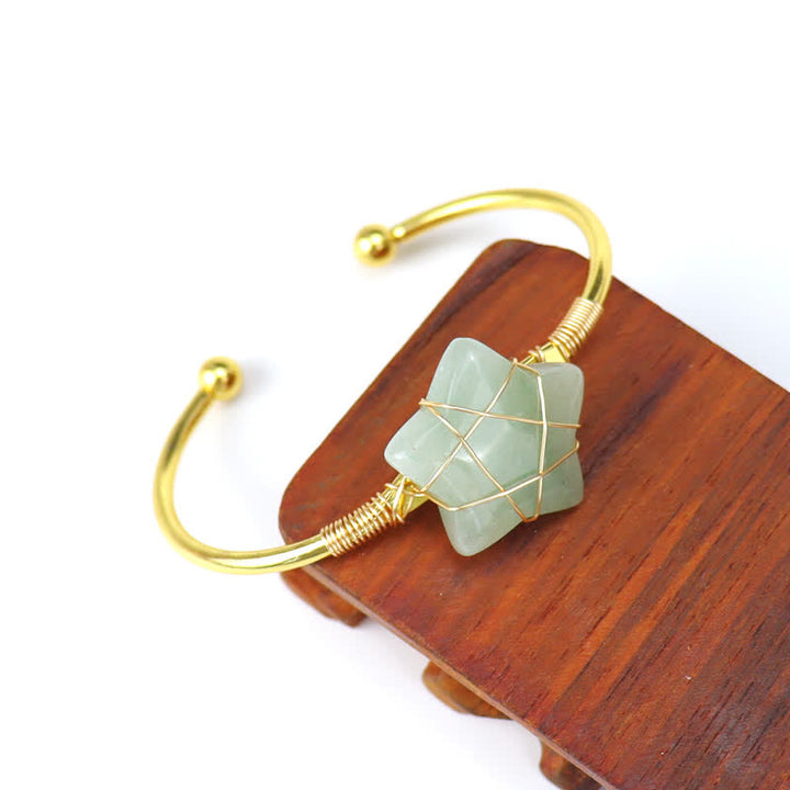 Bracciale Olivenorma con pietre preziose a forma di stella avvolte in filo d'oro