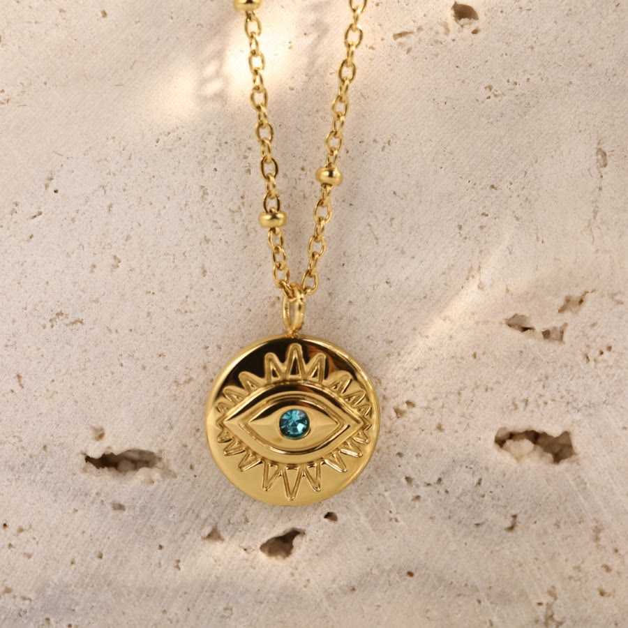 Collana in acciaio al titanio 316L con topazio blu e malocchio Olivenorma 
