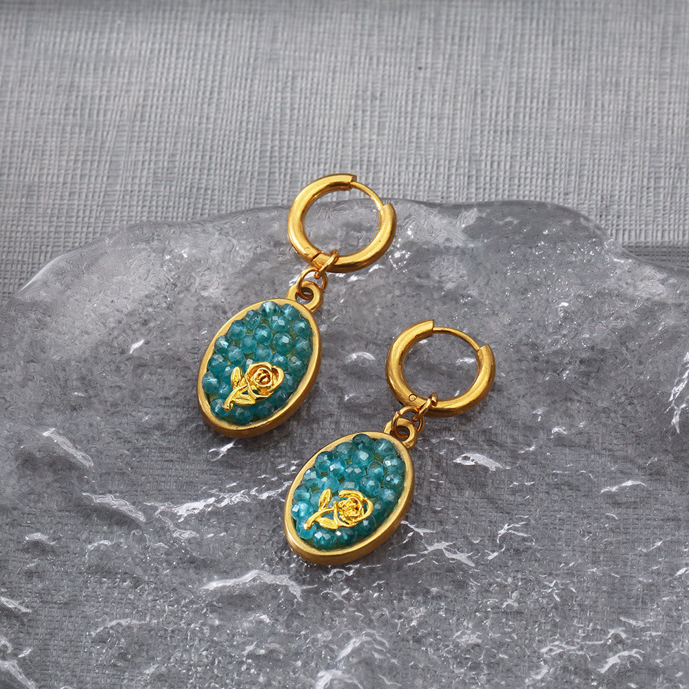Orecchini pendenti ovali in tormalina Paraiba Olivenorma con rosa schiacciata 