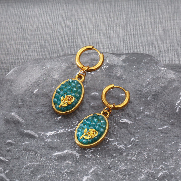 Orecchini pendenti ovali in tormalina Paraiba Olivenorma con rosa schiacciata 