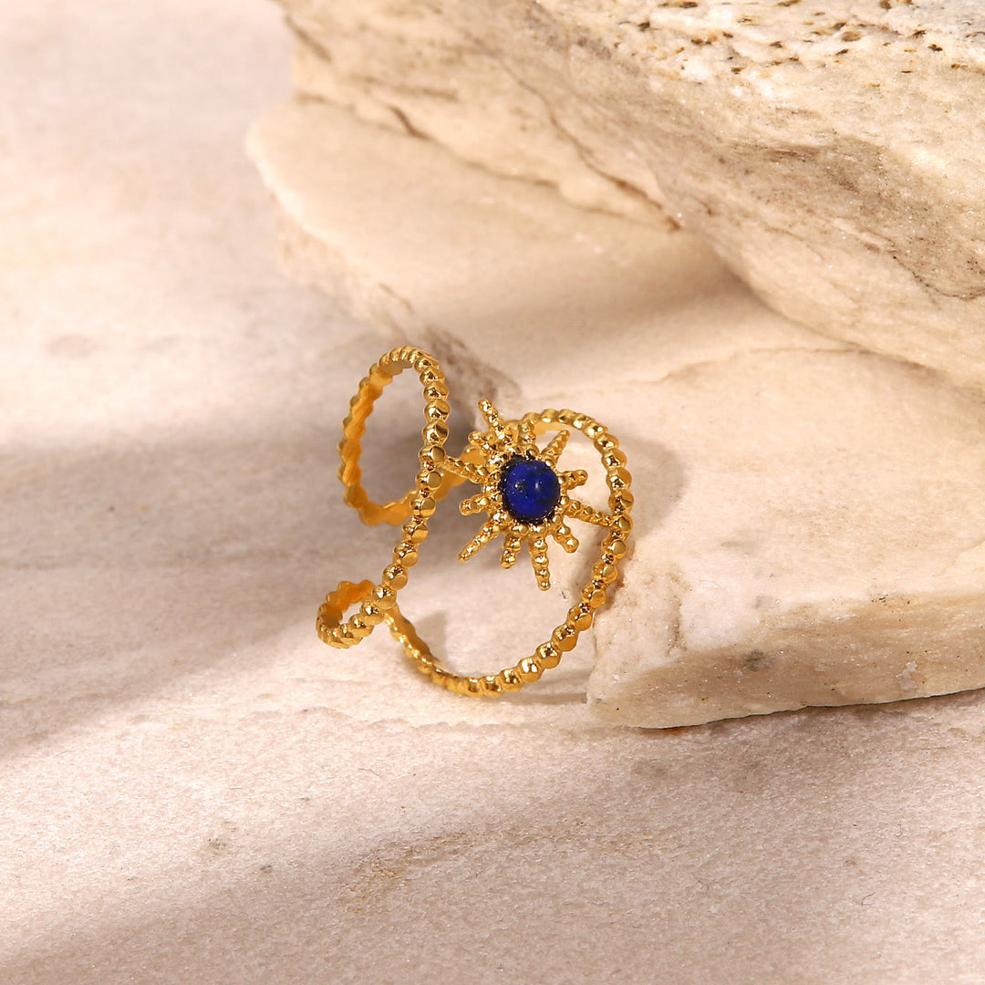Anello con gemma a forma di stella a otto punte e doppia fila di girasole Olivenorma