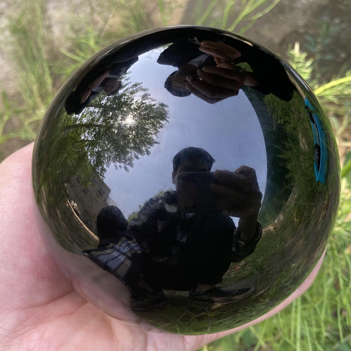 Decorazione una sfera di cristallo di ossidiana Olivenorma