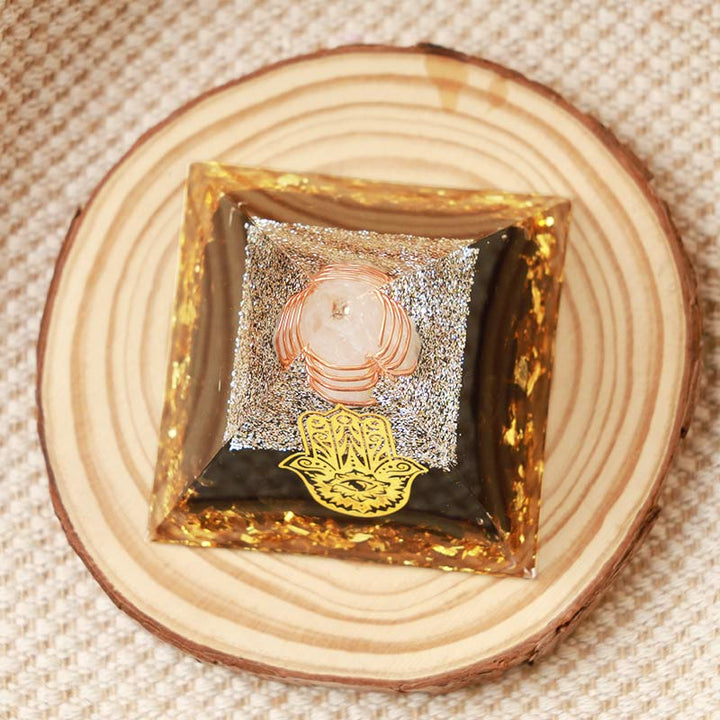 Olivenorma Cristallo trasparente con piramide di ossidiana Hamsa Orgone 
