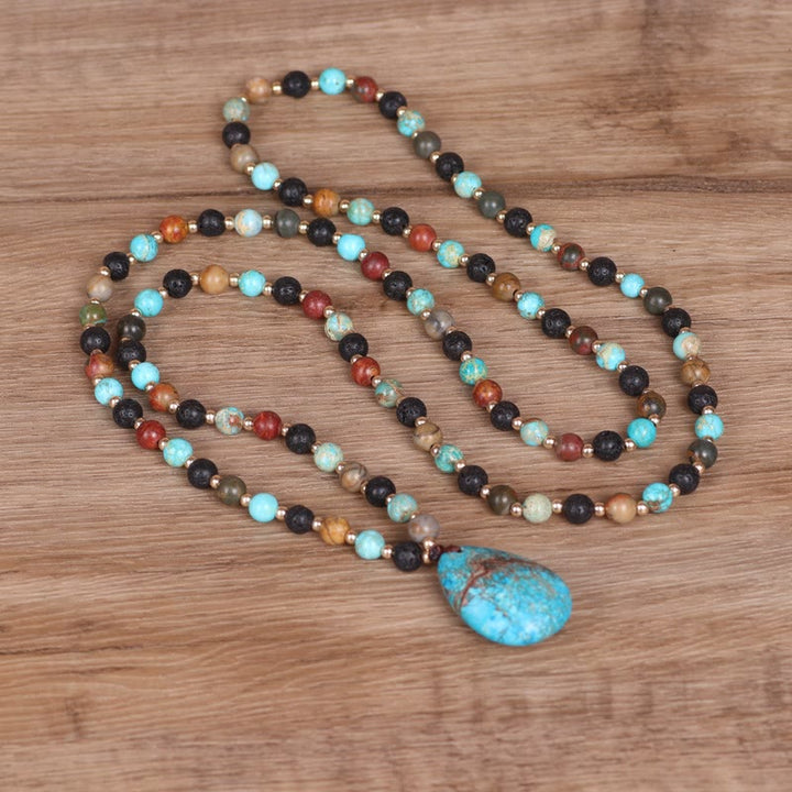 Collana di perline Mala con ciondolo a forma di goccia turchese Olivenorma
