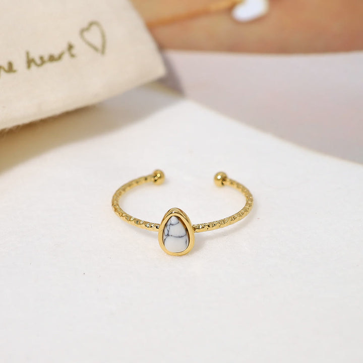 Anello in acciaio al titanio 18k con goccia d'acqua in pietra naturale Olivenorma