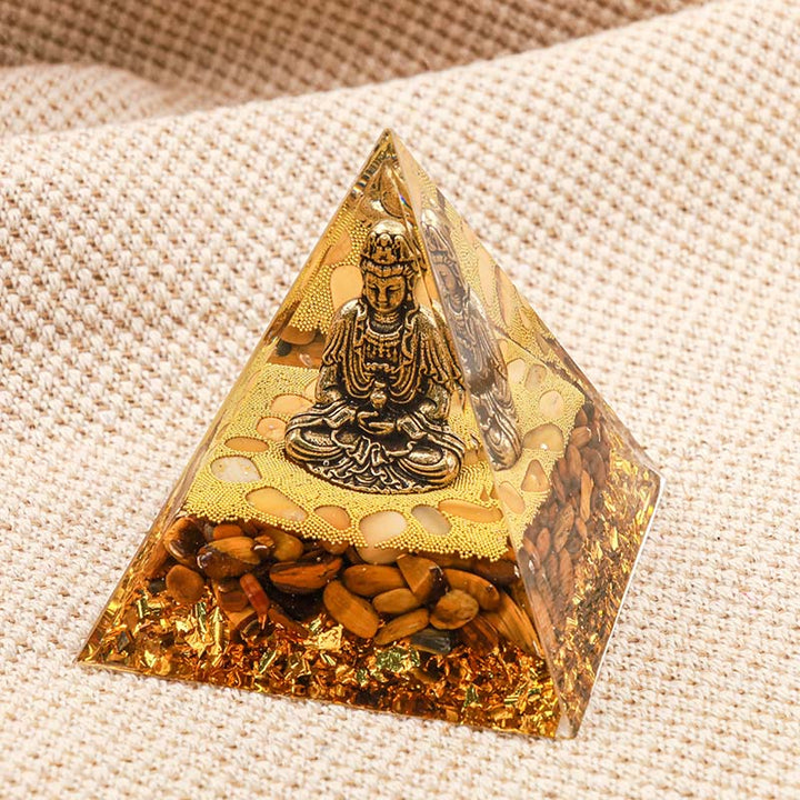 Buddha Olivenorma con piramide di orgone con protezione dell'occhio di tigre
