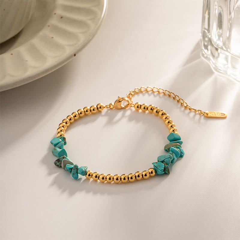Bracciale Olivenorma con perline dorate in cristalli naturali frantumati