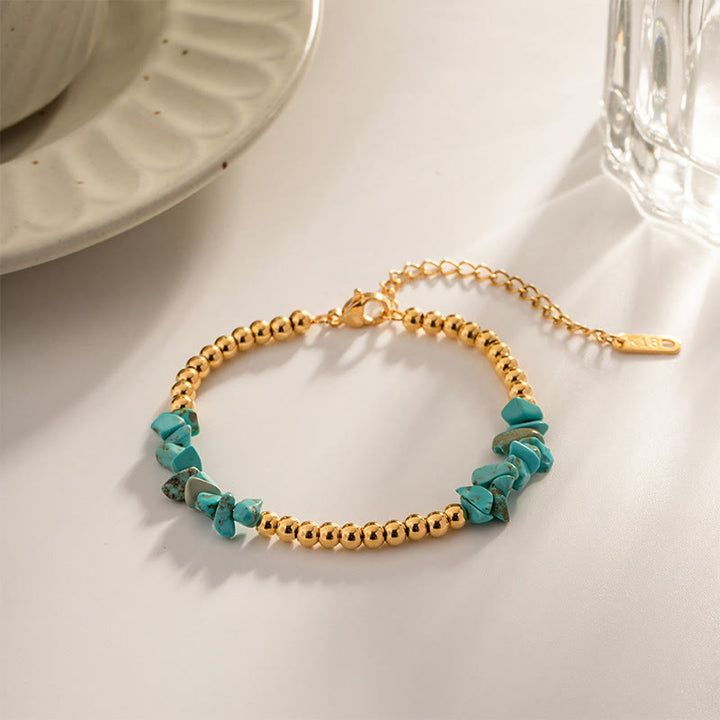 Bracciale Olivenorma con perline dorate in cristalli naturali frantumati