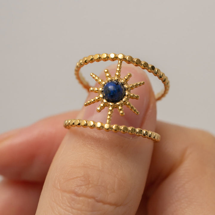 Anello con gemma a forma di stella a otto punte e doppia fila di girasole Olivenorma