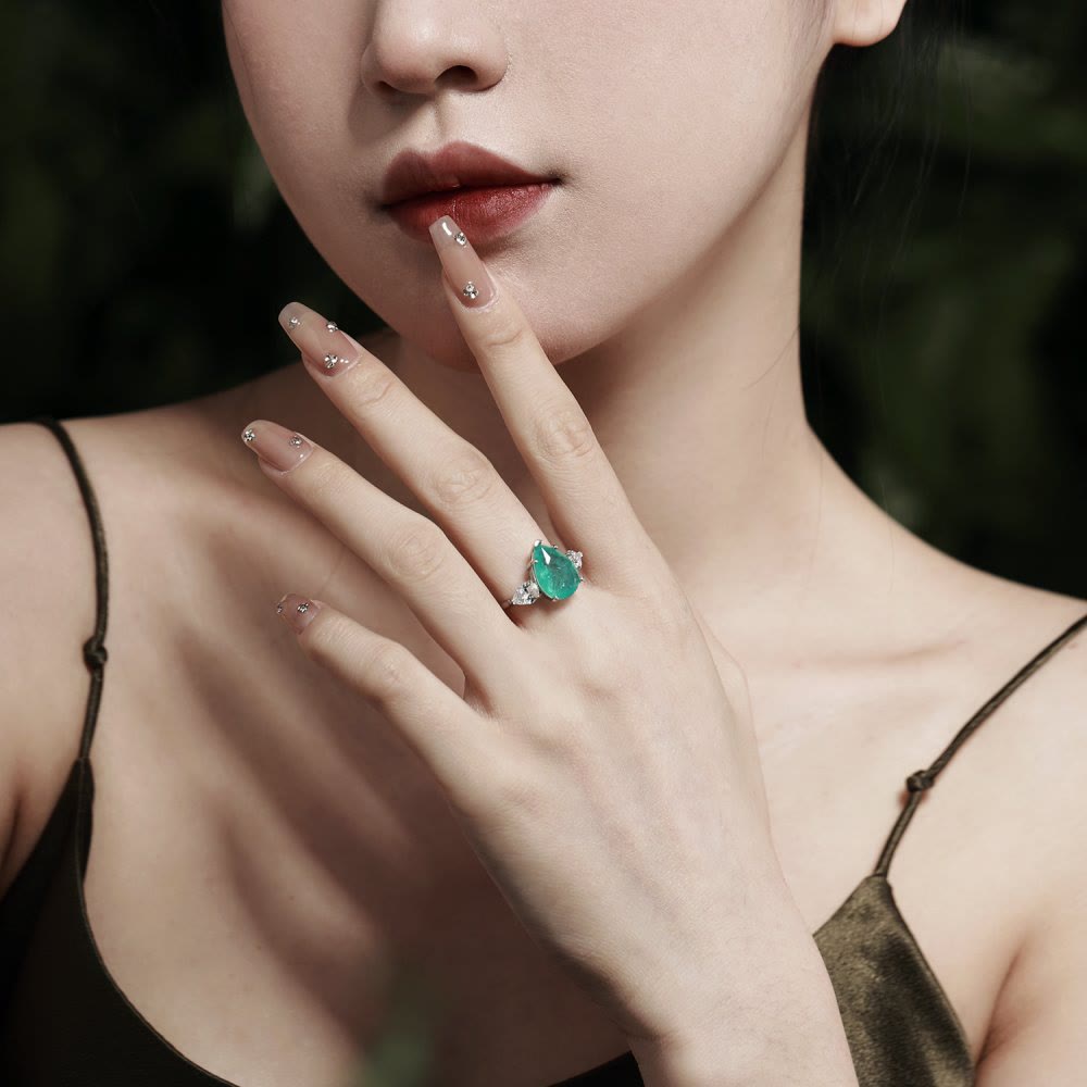 Anello squisito con tormalina Paraiba Olivenorma e zircone bianco