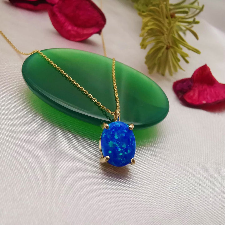 Collana Olivenorma in rame placcato oro 18k con opale bianco blu