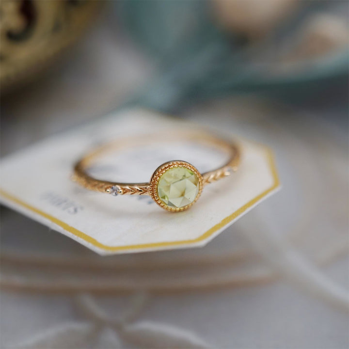 Anello Olivenorma con peridoto verde taglio rotondo naturale