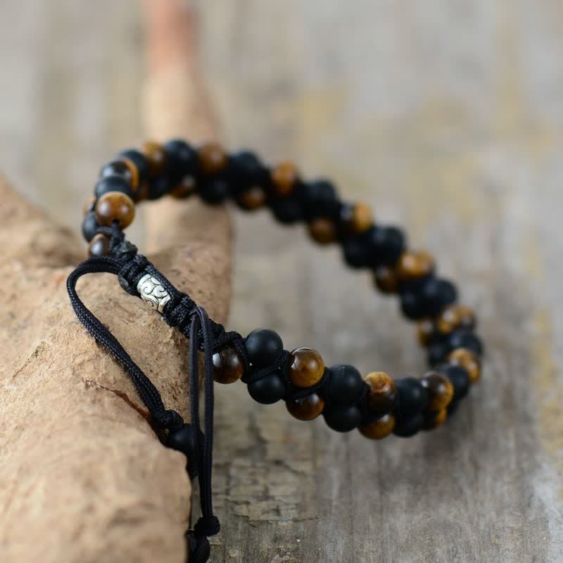 Bracciale intrecciato con perline di onice nero e occhio di tigre Olivenorma