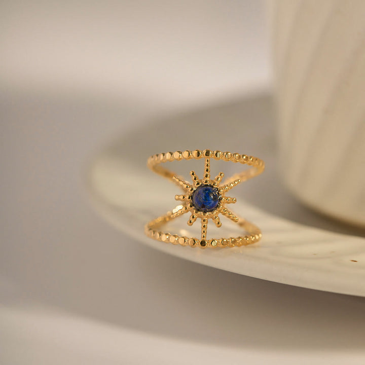 Anello con gemma a forma di stella a otto punte e doppia fila di girasole Olivenorma