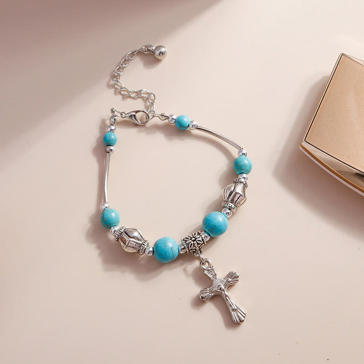 Bracciale con ciondolo a croce con perline turchesi Olivenorma