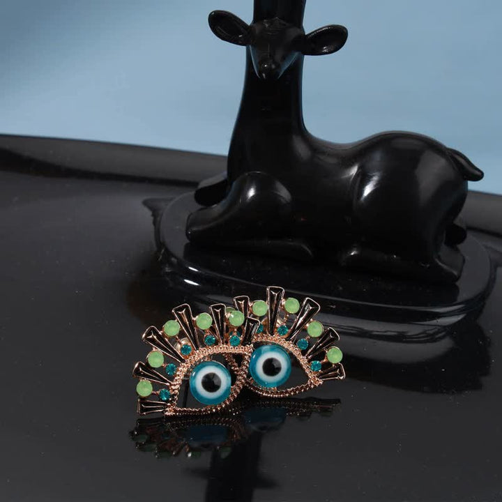 Olivenorma "Occhio della Sventura" - creativi Orecchini in zaffiro con pavone