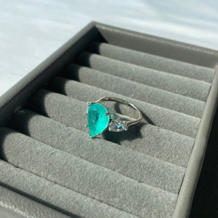 Anello squisito con tormalina Paraiba Olivenorma e zircone bianco