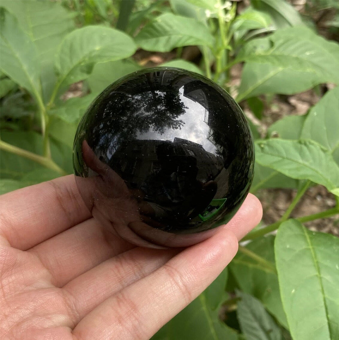 Decorazione una sfera di cristallo di ossidiana Olivenorma