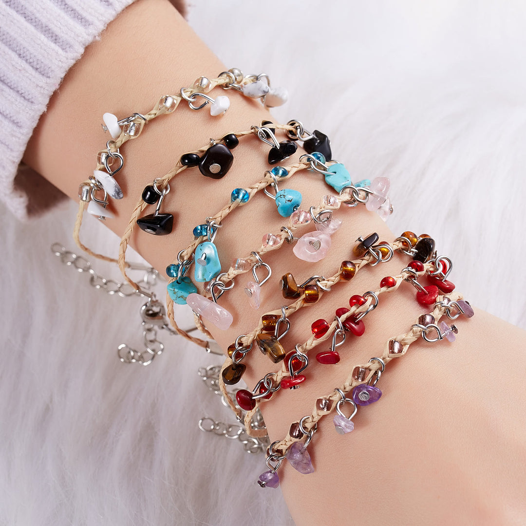 Bracciale intrecciato con ghiaia, nappa, ossidiana, occhio di tigre e ametista Olivenorma