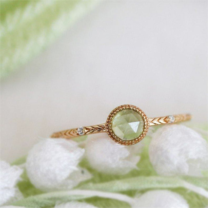Anello Olivenorma con peridoto verde taglio rotondo naturale