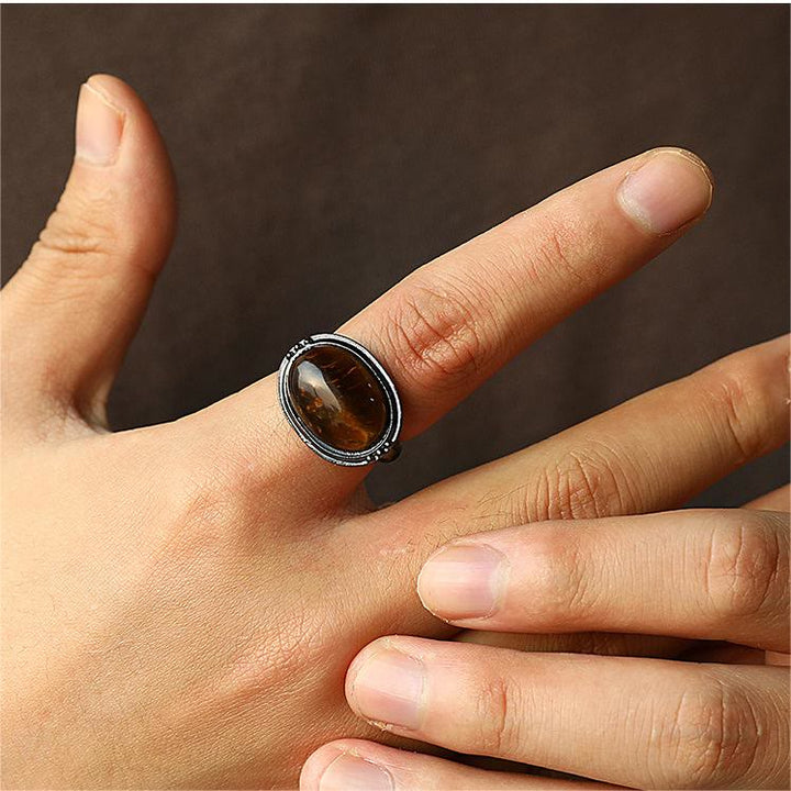 Olivenorma Anello regolabile nero ovale con occhio di tigre