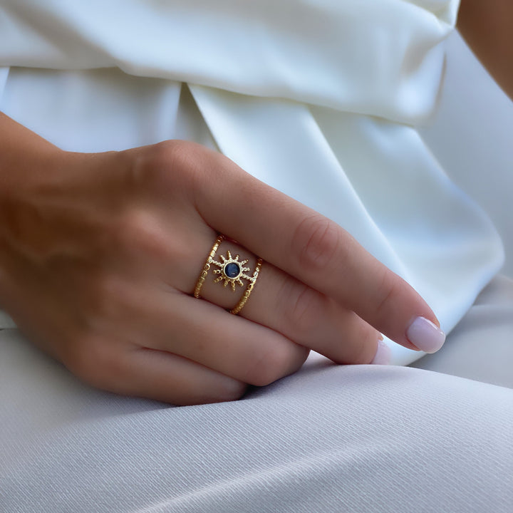 Anello con gemma a forma di stella a otto punte e doppia fila di girasole Olivenorma