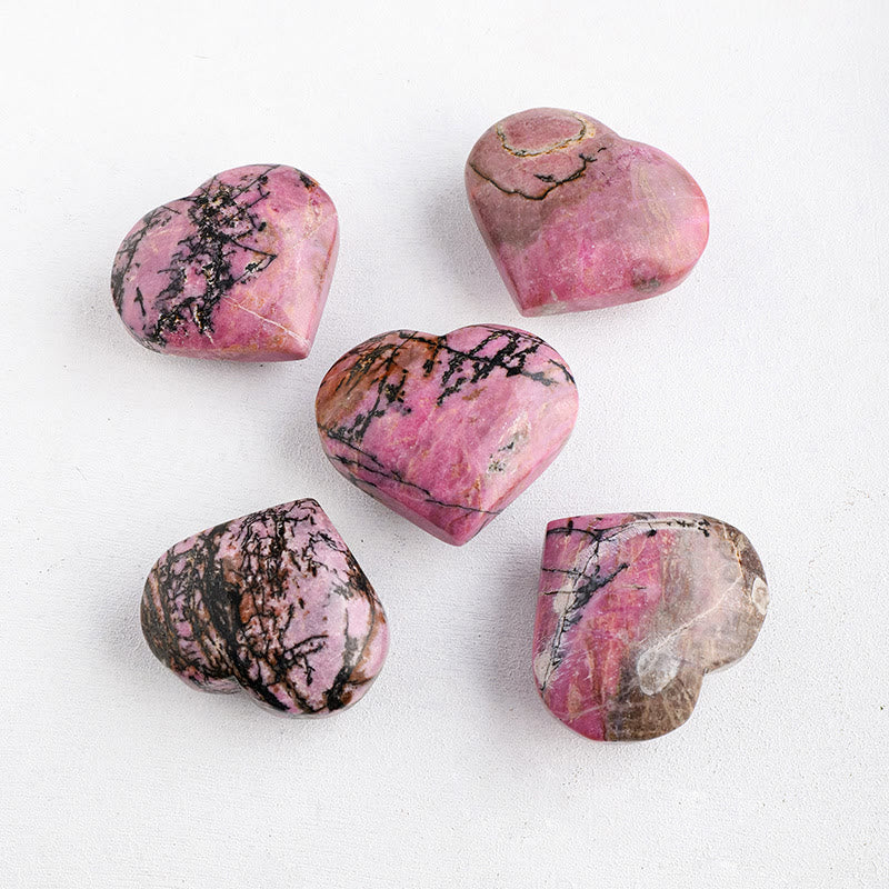 Pietra da gioco lucidata in rodonite Olivenorma con cuore di cristallo