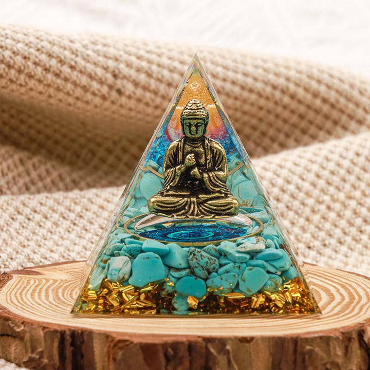 Buddha Olivenorma con piramide di orgone in equilibrio turchese naturale