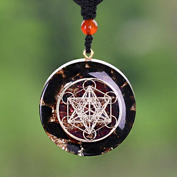 Collana con simbolo del cubo di Metatron in ossidiana e granato Olivenorma