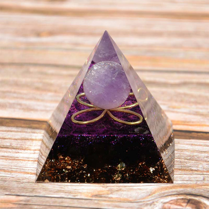 Sfera di ametista Olivenorma con piramide di orgone di ossidiana 