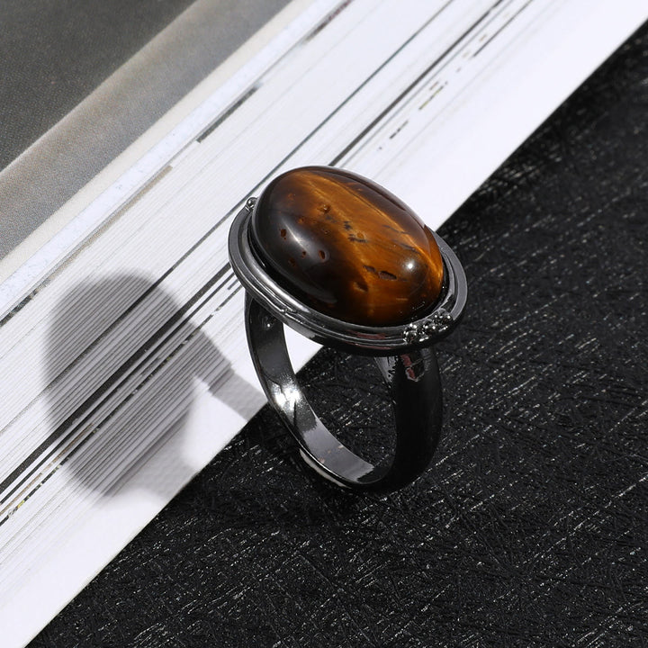 Olivenorma Anello regolabile nero ovale con occhio di tigre