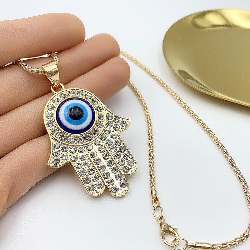 Collana con ciondolo a forma di catena con zircone HAMSA e occhio malvagio