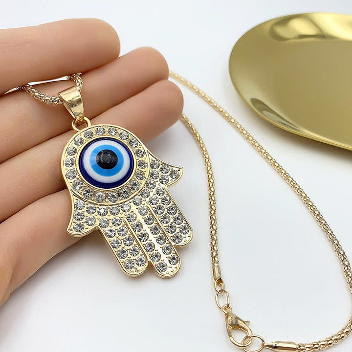 Collana con ciondolo a forma di catena con zircone HAMSA e occhio malvagio