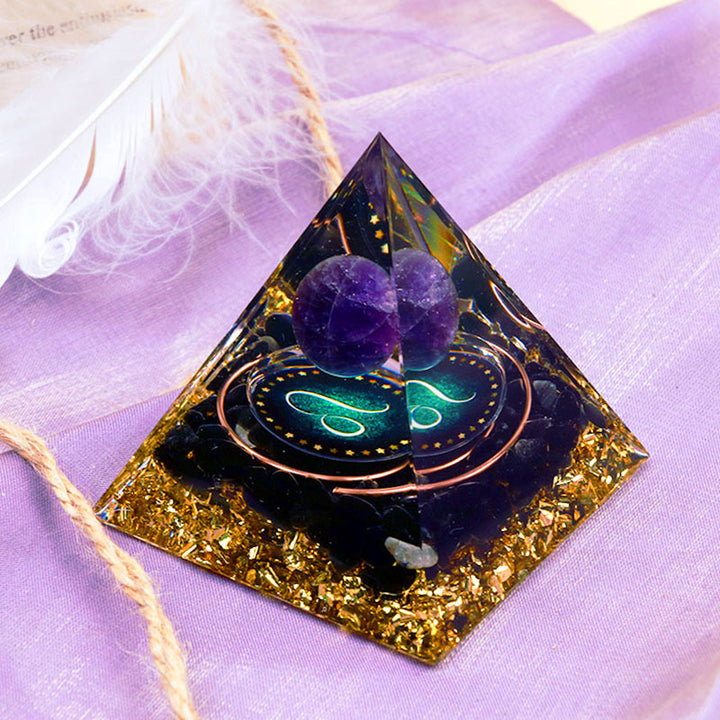 Sfera di ametista Olivenorma con piramide di orgone dello zodiaco Leone in ossidiana 