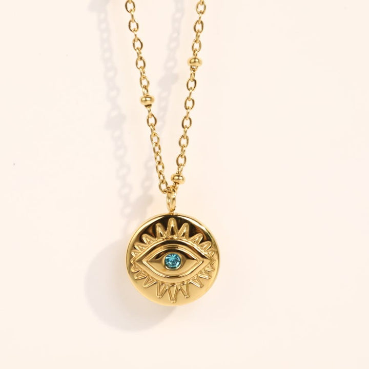Collana in acciaio al titanio 316L con topazio blu e malocchio Olivenorma 