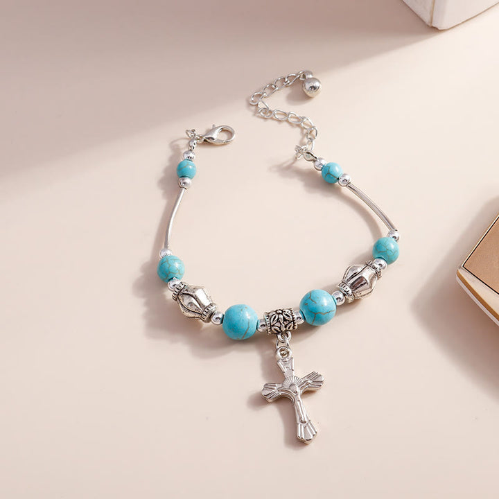 Bracciale con ciondolo a croce con perline turchesi Olivenorma