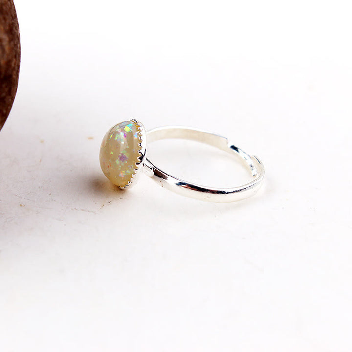 Anello regolabile semplice a semicerchio con pietra di luna e opale Olivenorma 