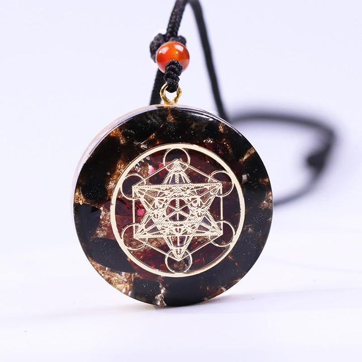 Collana con simbolo del cubo di Metatron in ossidiana e granato Olivenorma