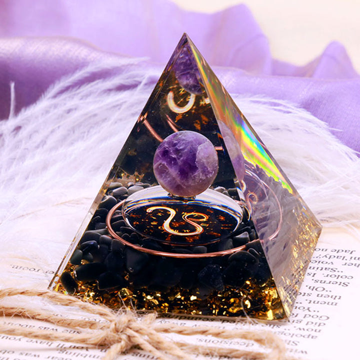 Sfera di ametista Olivenorma con piramide di orgone dello zodiaco Leone in ossidiana 