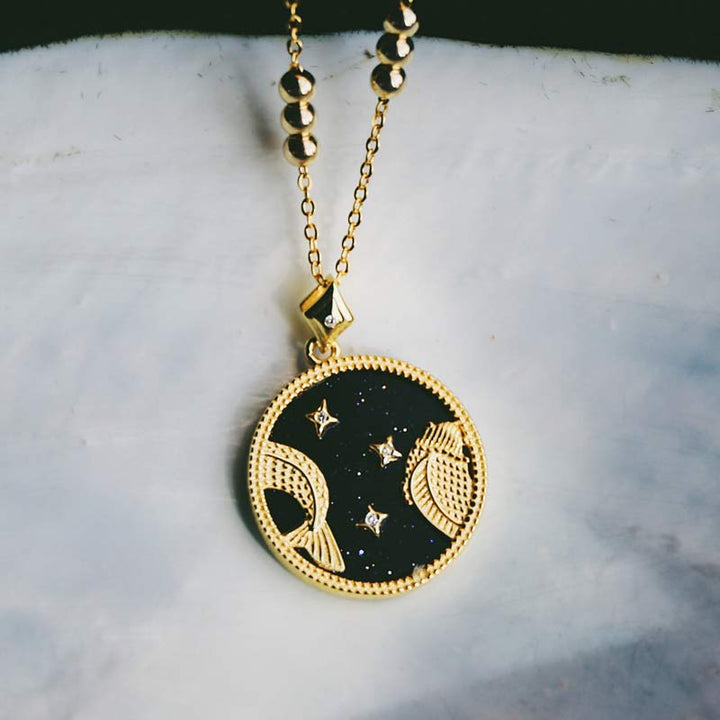 Collana Zodiaco in ascolto in arenaria blu 