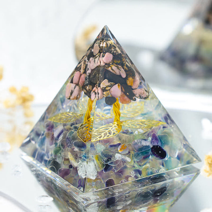 Olivenorma Rhodonite con piramide di orgone di crescita di fluorite