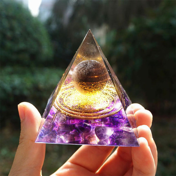 Olivenorma Sfera di quarzo fumé con piramide di orgone di ametista 