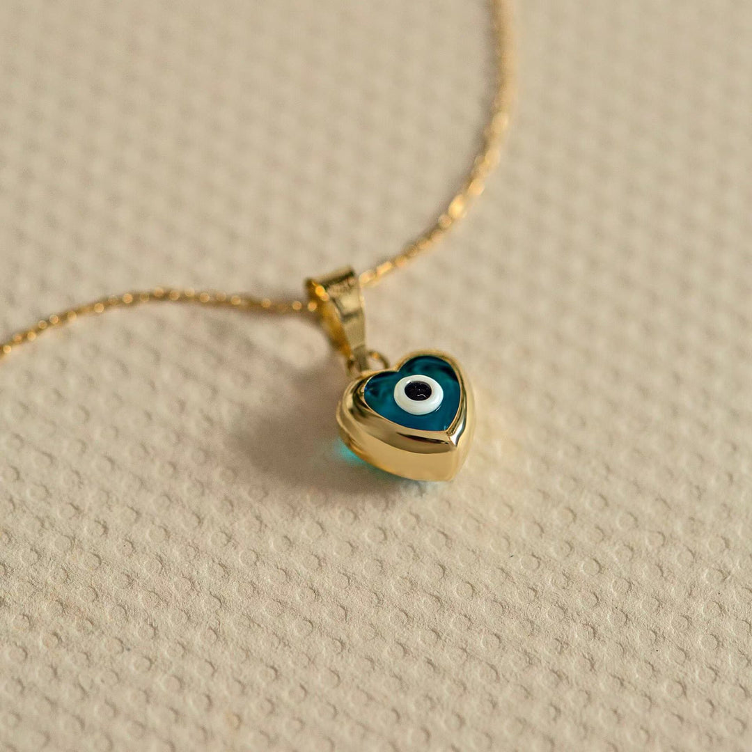 Collana in acciaio e titanio con occhio maligno e topazio blu Olivenorma 