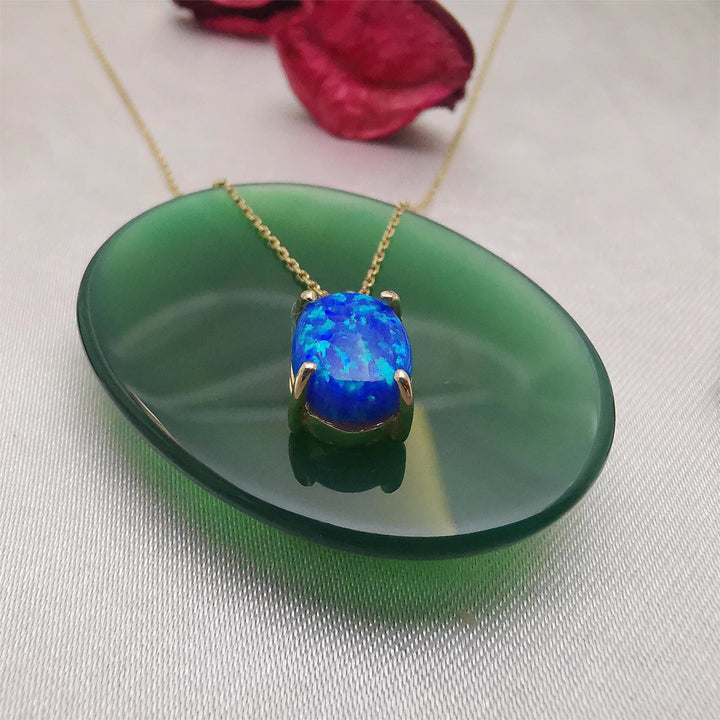 Collana Olivenorma in rame placcato oro 18k con opale bianco blu