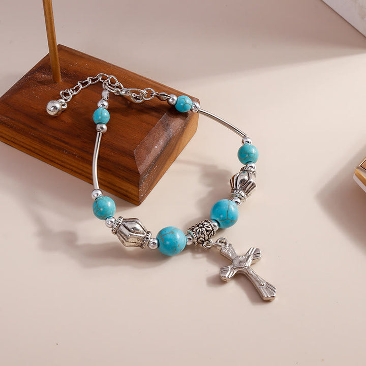 Bracciale con ciondolo a croce con perline turchesi Olivenorma