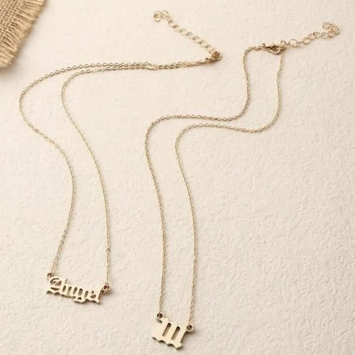 Collana doppia delicata con numero angolare e angelo Olivenorma 